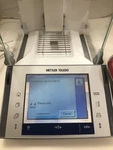 Mettler Toledo XP204 Balance Scale Fact, 220G/0.1MG Tested Auto Door! Cosmetic. Fixed Price $2563.99.