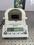 Precisa XM60 Moisture Analyzer Balance 124G/0.001G Works, Needs Calibration. Fixed Price $1215.00.