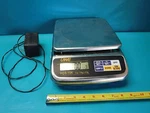 Used Stainless Steel Uwe HGS-15K Scale Cap 15KGX0.5G. Fixed Price $250.00.