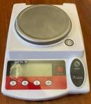 Optima Precision Balance 500G X 0.01G 6-1/2" 7-5/16" OPH-T502LCD. Fixed Price $159.00.
