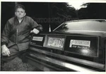 1989 Press Photo Reverend Ronald Rice Displaying Bumper Stickers His Car. Fixed Price $24.99.